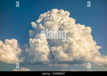 a big and fluffy cumulonimbus cloud in the blue sky Stock Photo