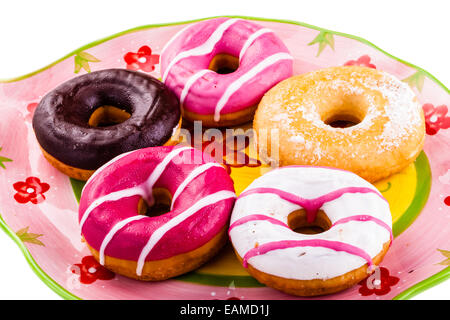 a collection of delicious and colorful donuts on a plate Stock Photo