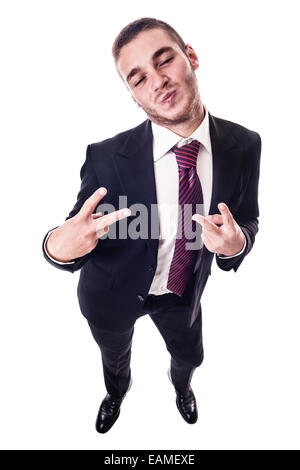 a young businessman making the peace sign and a silly face isolated over a white background Stock Photo