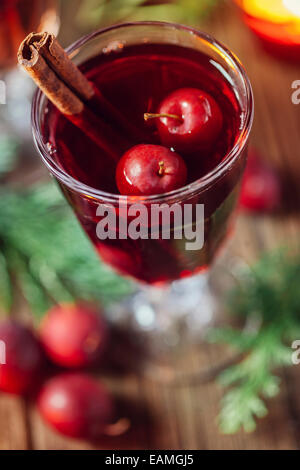Hot mulled wine with small crab apples Stock Photo