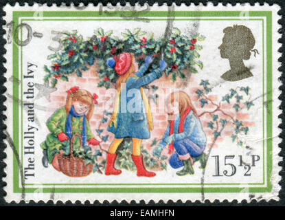 UNITED KINGDOM - CIRCA 1982: Postage stamp printed in England, Christmas Issue, shows the Holly and the Ivy, circa 1982 Stock Photo