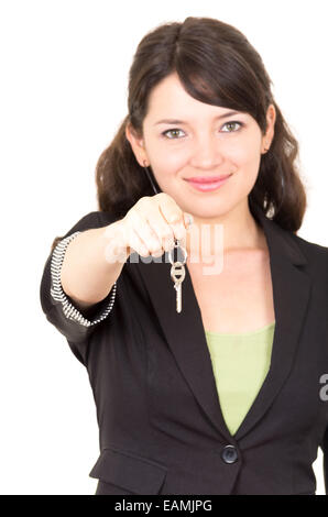 portrait of beautiful young woman holding key Stock Photo