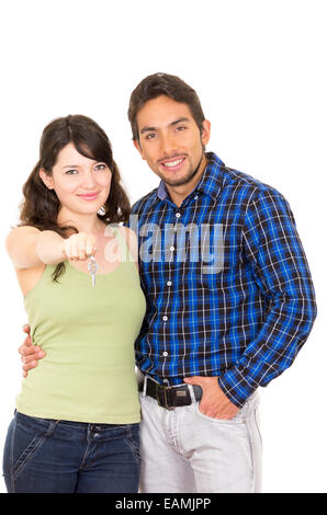 attractive young happy couple hugging and holding key Stock Photo