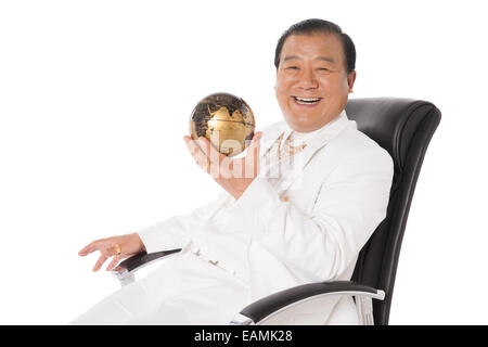Successful man with a gold ingot Stock Photo