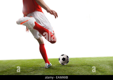 A football player is playing football Stock Photo