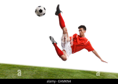The football player handstand to play football Stock Photo