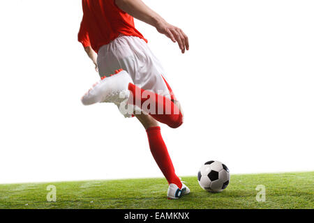 A football player is playing football Stock Photo