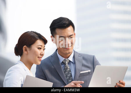 Business people using laptops Stock Photo