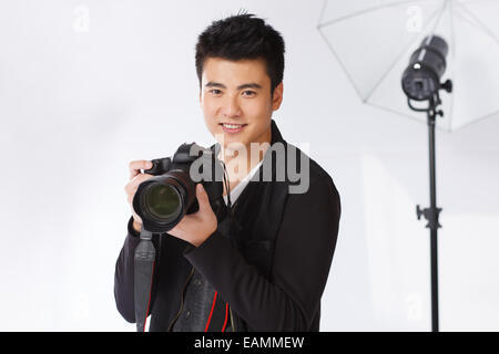 Fashion handsome young photographers Stock Photo