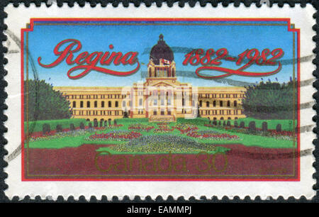Postage stamp printed in Canada, dedicated to the centennial of the city of Regina, shows Parliament building Stock Photo