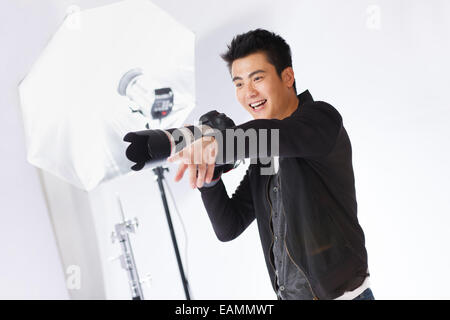 Photographers are working in film studio Stock Photo