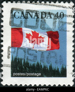 CANADA - CIRCA 1990: A stamp printed in Canada shows Canadian flag and ...