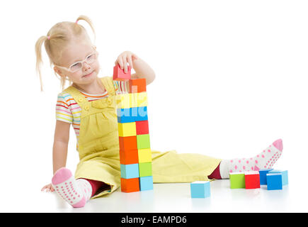 Child in eyeglases playing building blocks isolated Stock Photo