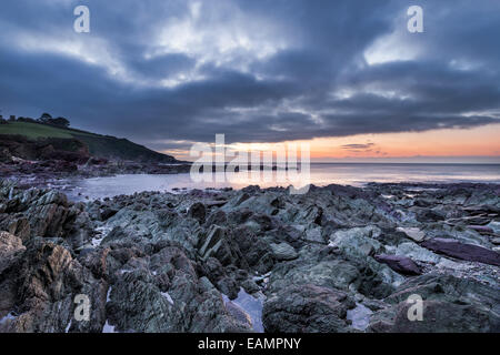 Dawn at Talland Bay a small rocky cove between Looe and Polperro in Cornwall Stock Photo