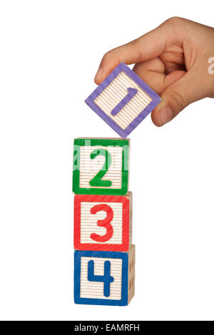 Hand stacking number blocks isolated on white background Stock Photo