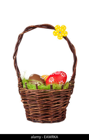 Easter basket with colored eggs, isolated on white background Stock Photo