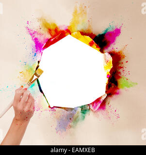 Concept of art with blank ripped paper and woman hand holding paintbrush. Free space for text Stock Photo