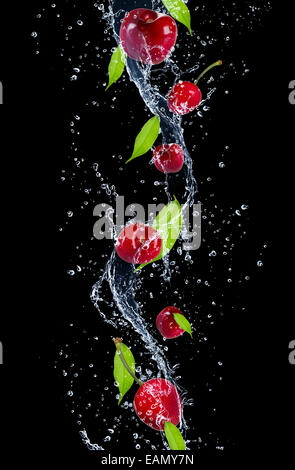 Cherries in a splash of water on a black background. Neural network AI