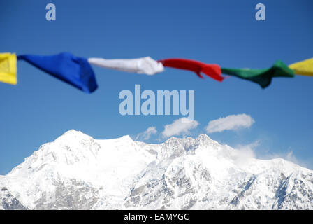 The Himalayan mountain of Kangchenjunga is framed by Buddhist prayer flags Stock Photo