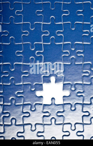 blue jigsaw puzzle, one piece missing Stock Photo