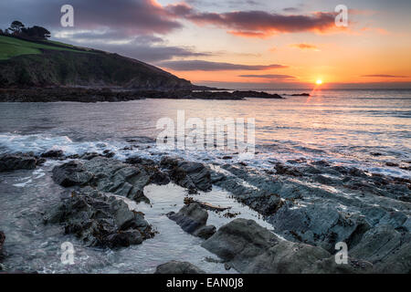 Winter sunrise over Talland bay on the Cornwall coast Stock Photo
