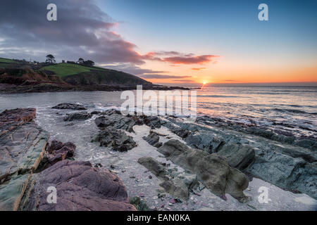 Sunrise over Talland Bay on the Cornwall coast between Looe and Polperro Stock Photo