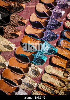 Arabian shoes on sale in a traditional souk in old Dubai, United Arab Emirates. Stock Photo
