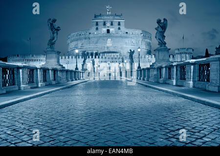 Rome. Toned image of the Castle of Holy Angel and Holy Angel Bridge over the Tiber River in Rome at sunrise. Stock Photo