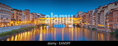 Florence. Panoramic image of historical center of Florence with Ponte Vecchio during twilight blue hour. Stock Photo