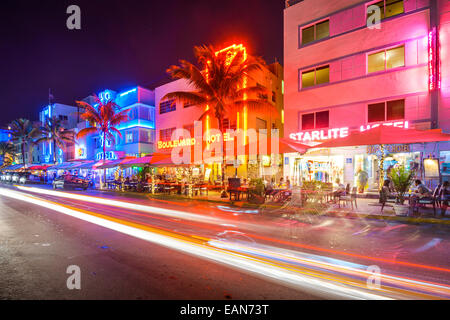MIAMI, FLORIDA - JANUARY 6, 2014: Cars speed down Ocean Drive. The road is the main thoroughfare through South Beach.
