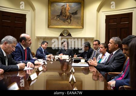 US President Barack Obama joins National Security Advisor Susan E. Rice's meeting with Syrian Opposition Coalition President Ahmad Jarba, second from left, in the Roosevelt Room of the White House May 13, 2014 in Washington, DC. Stock Photo