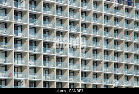 Abstract Architecture: A geometric pattern is created by highlights and shadows of the outdoor patios of a cement building. Stock Photo