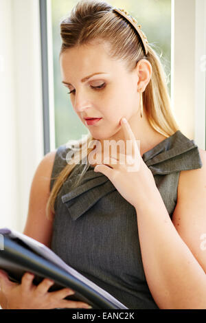 Woman stressed in office Stock Photo