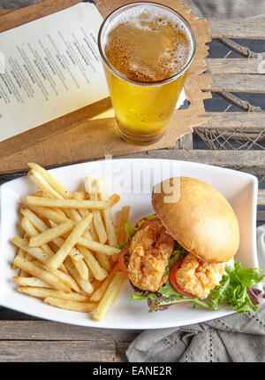 Shrimp Po Boy with french fries and beer Stock Photo