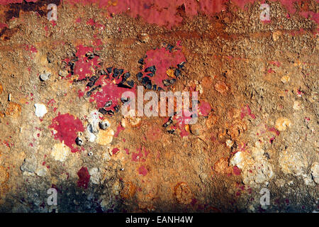 Old paint flaking on rusty corroding steel, closeup texture detail Stock Photo