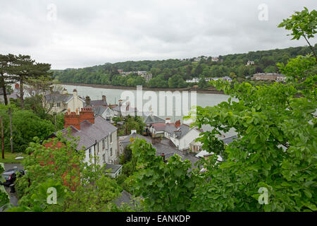 View, from high suspension bridge over wide Menai Strait, of town of Beaumaris on Isle of Anglesey & coast of Welsh mainland Stock Photo