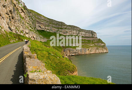 Narrow road, Marine Drive, winding around perimeter of hill, the Great Orme, at Llandudno with Irish Sea at base of high cliffs Stock Photo