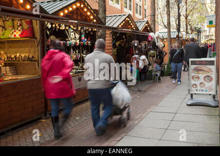 Traditional Festive Dickensian Christmas Festival Street Market Stalls in St Annes Square, Manchester, UK Stock Photo