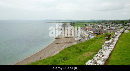 View, from hilltop castle, of historic Welsh town of Criccieth with houses beside sandy beach of Cardigan Bay & green fields Stock Photo