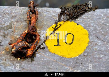 The number 10 painted on the quayside in Mevagissey Cornwall England UK Stock Photo