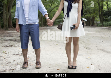 A couple, a man and woman in a Kyoto park. Stock Photo