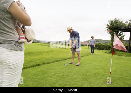 Family on a golf course. Stock Photo