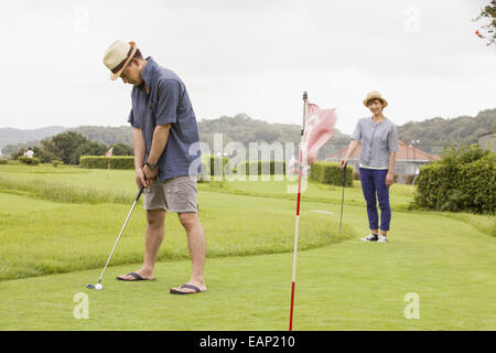 Couple on a golf course. Stock Photo