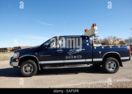 pilot car pickup truck accompanying an oversized load Saskatchewan Canada Stock Photo
