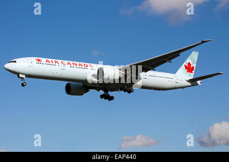 Air Canada Boeing 777-300 approaches runway 27L at London Heathrow Airport. Stock Photo