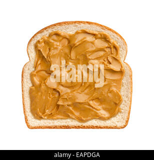 Aerial view of swirling peanut butter on a  slice of white bread. The subject is isolated on a white background. Stock Photo