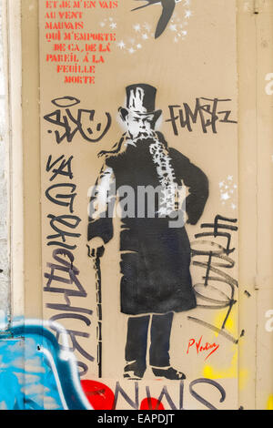 graffito showing a portrait of french poet paul verlaine next to the last verse of the poem chanson d´automne, paris Stock Photo