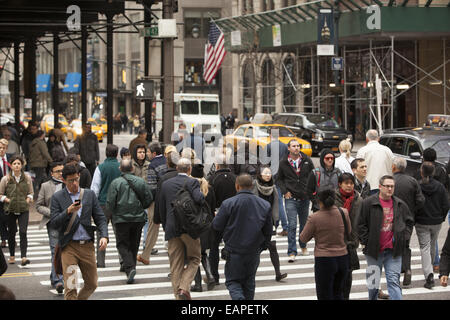 5th Ave. at 42nd Street is one of the most constantly crowded corners in New York City. Stock Photo