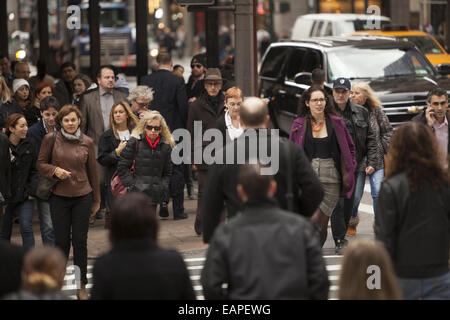 5th Ave. at 42nd Street is one of the most constantly crowded corners in New York City. Stock Photo