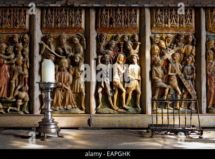 Medieval carved wooden altar piece depicting the crucifixion of Jesus Christ in the chapel at Haddon Hall in Derbyshire England Stock Photo